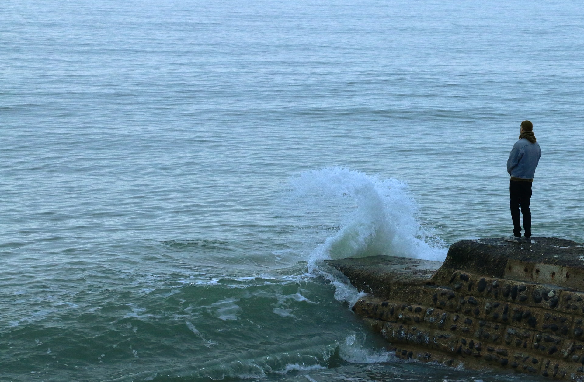 brown rock formation on sea during daytime